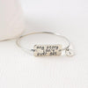 Image of SEMICOLON BANGLE